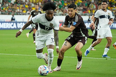Angelo Preciado is challenged by Gerardo Arteaga